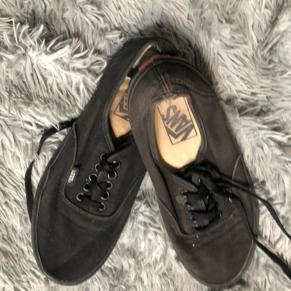 Black women lace up vans